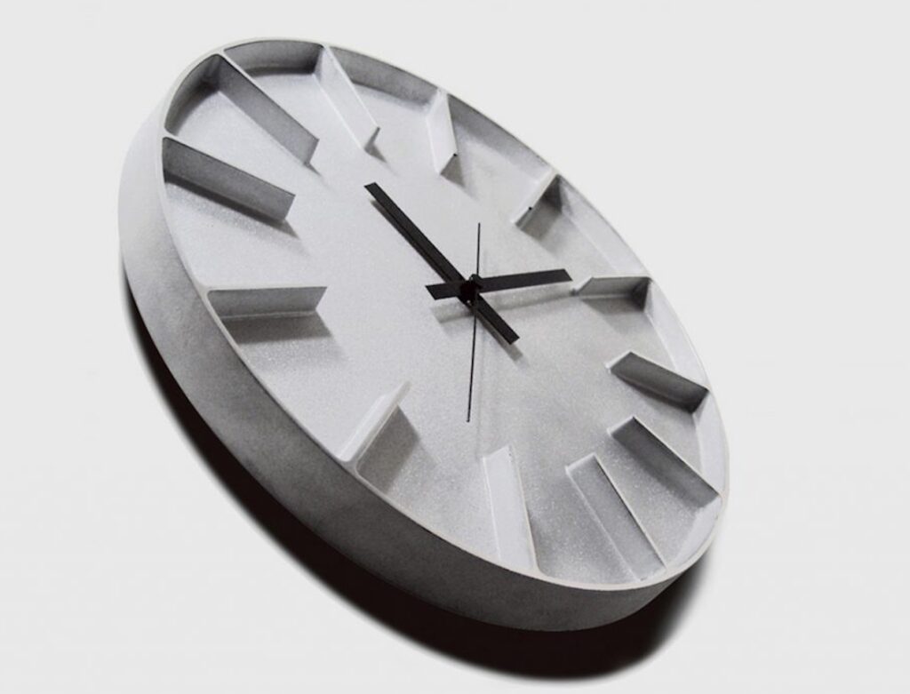 Aluminum wall clock photographed on slant