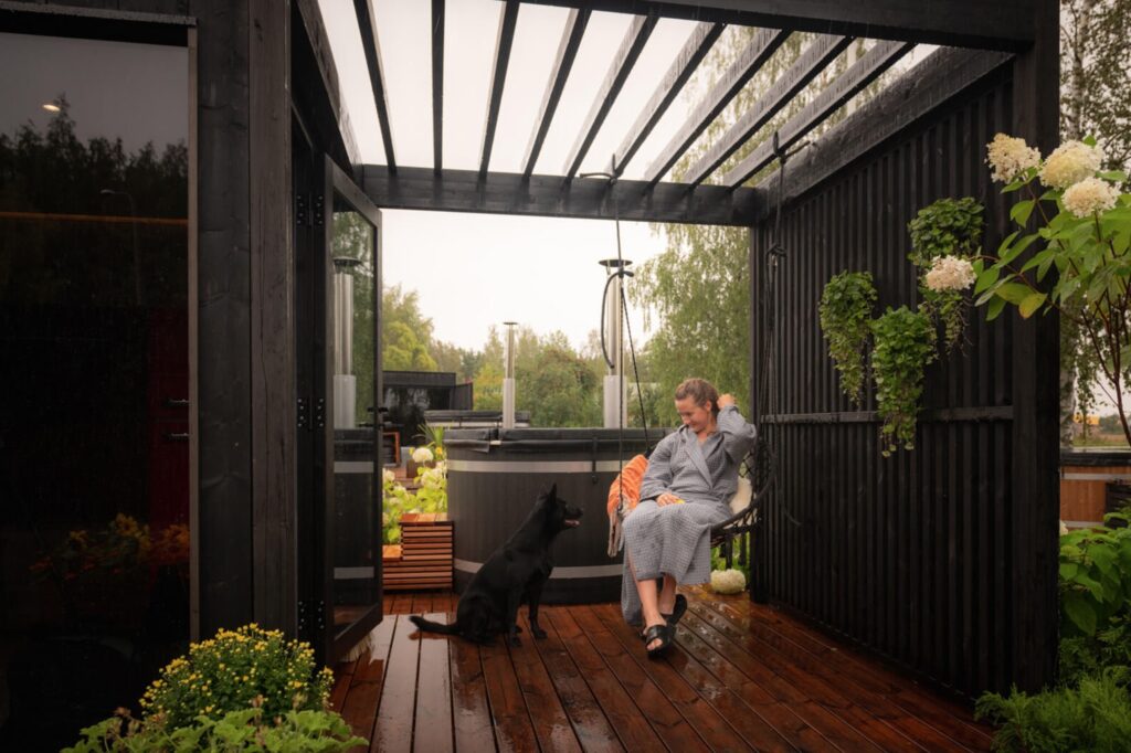 Woman with dog in Thermasol backyard oasis