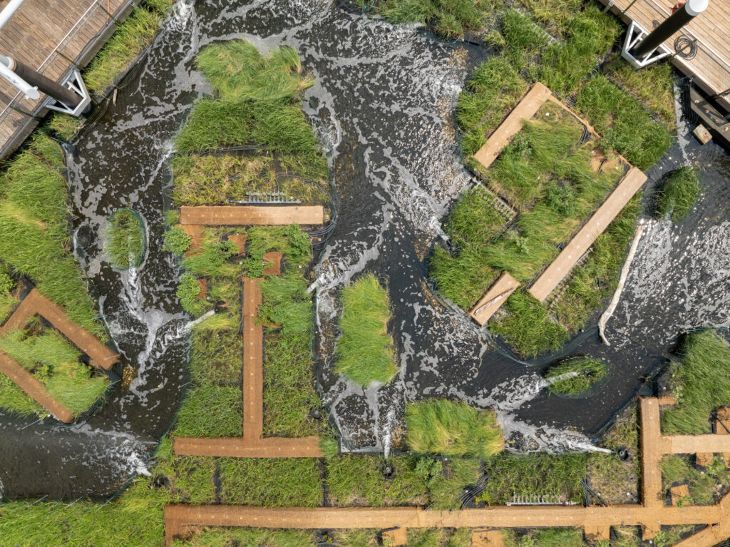 Aerial view of Harbor Wetland with waterway and pontoons visible
