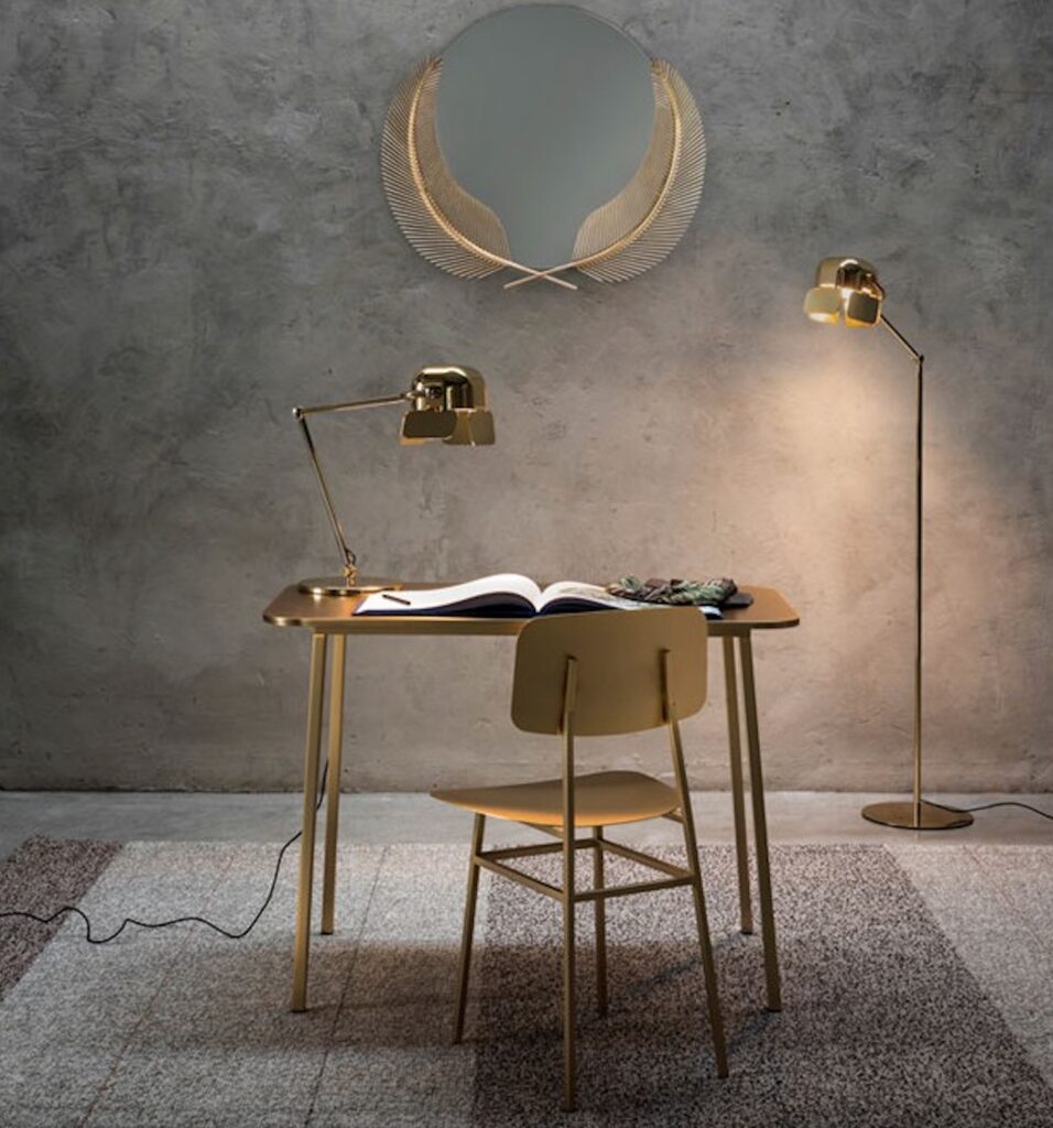 Desk in room with polished concrete walls and floor