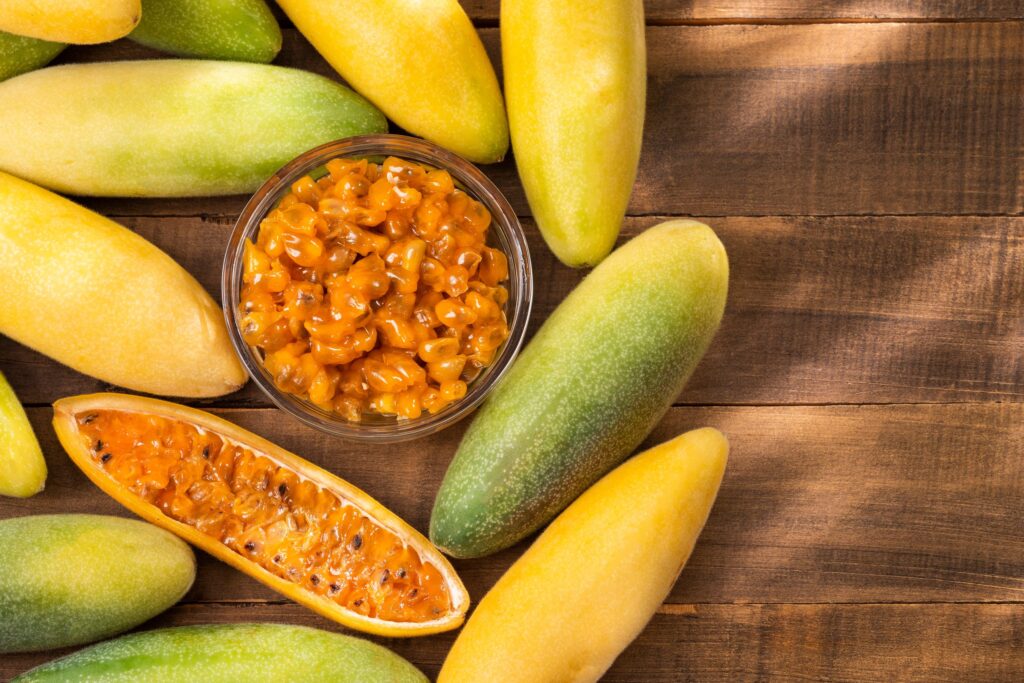 Image of banana passion fruits with one cut in half