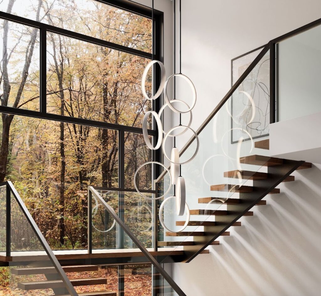 Mono-pendant display in stairwell with view of trees