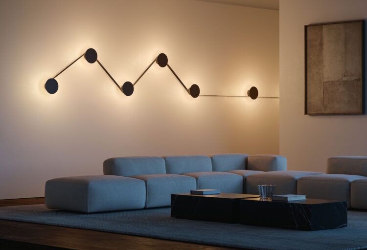 Lodes MAP zigzag pattern on wall above blue sofa