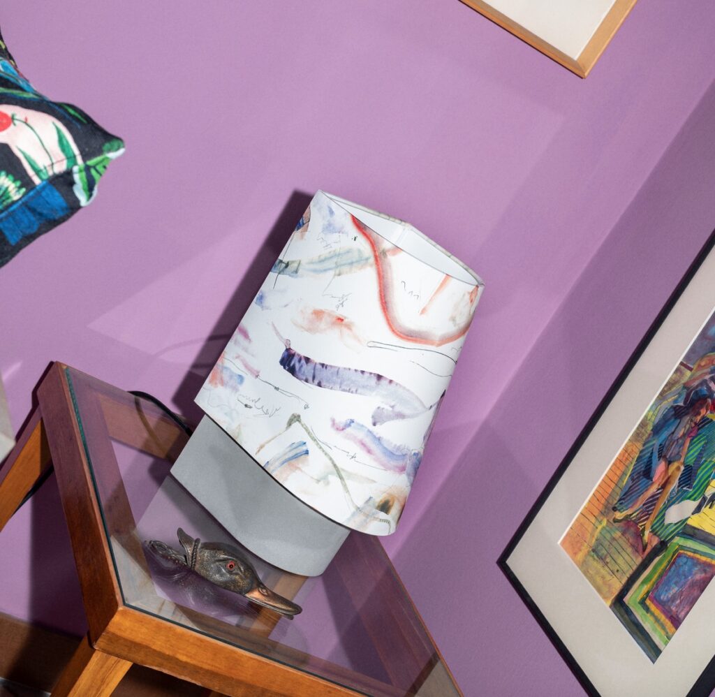 Huf on glass side table with fashionable shade