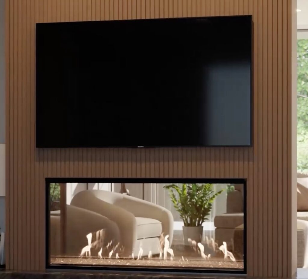 Fireplace mounted beneath TV