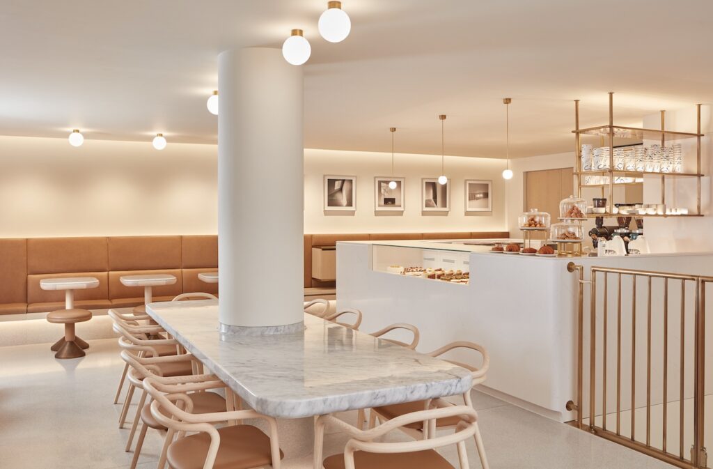 Many chairs around marble dining table in café
