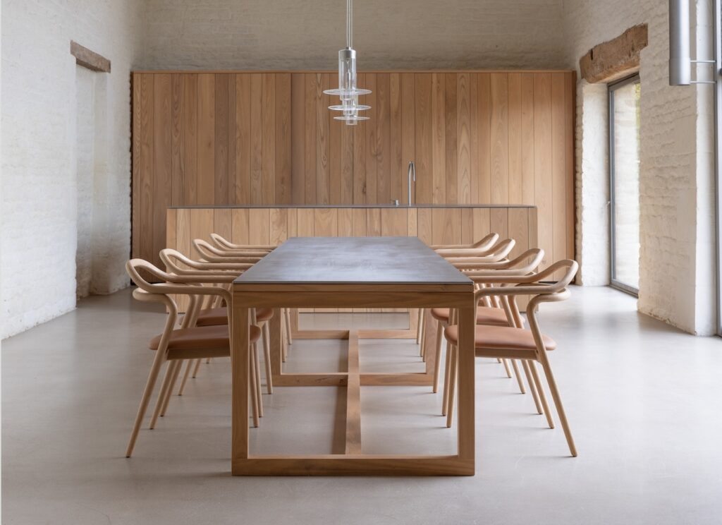 Many chairs around large rectangular table