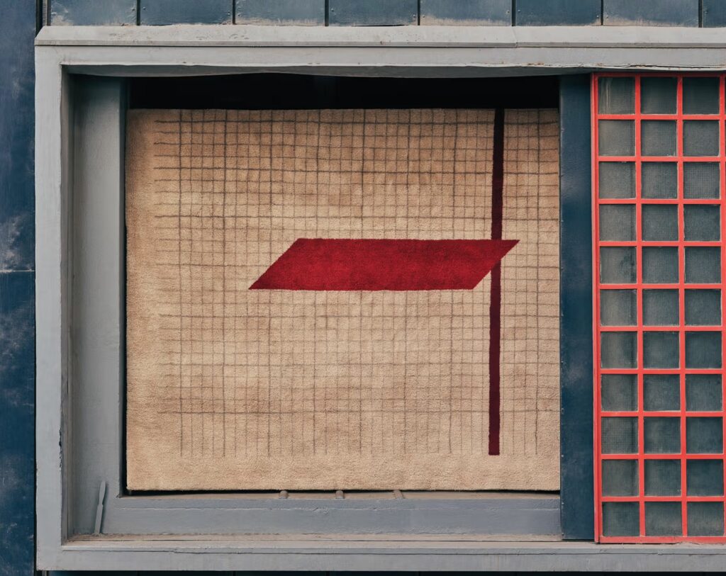 Rug based on graph paper wiht dark red line and cherry red trapezoid