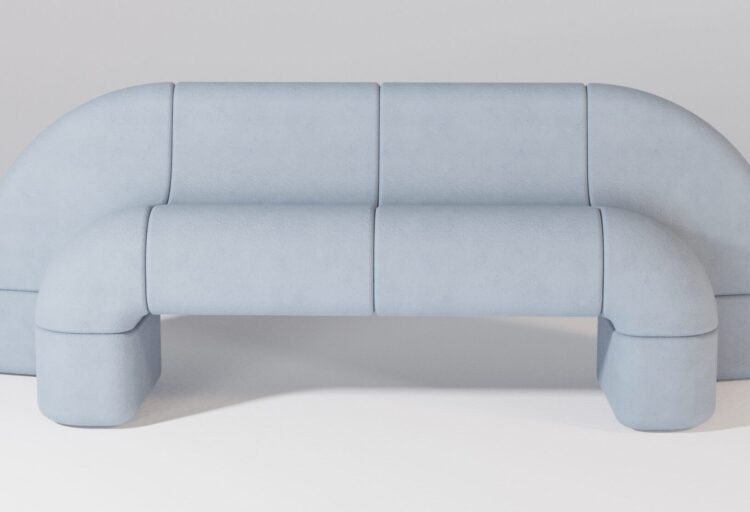 Long, modular bench in cool blue-gray concrete with smooth, rounded geometry—reads like a single fluid line across the ground plane.