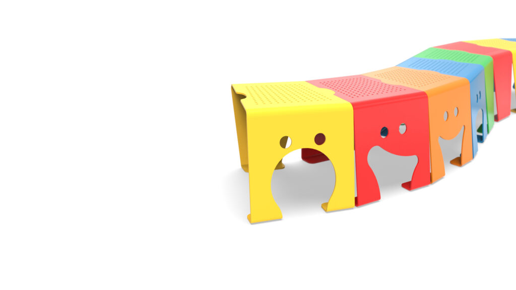 Row of colorful perforated metal benches in red, yellow, orange, green, and blue, each with a happy or sad face cutout, bringing personality to public seating.
