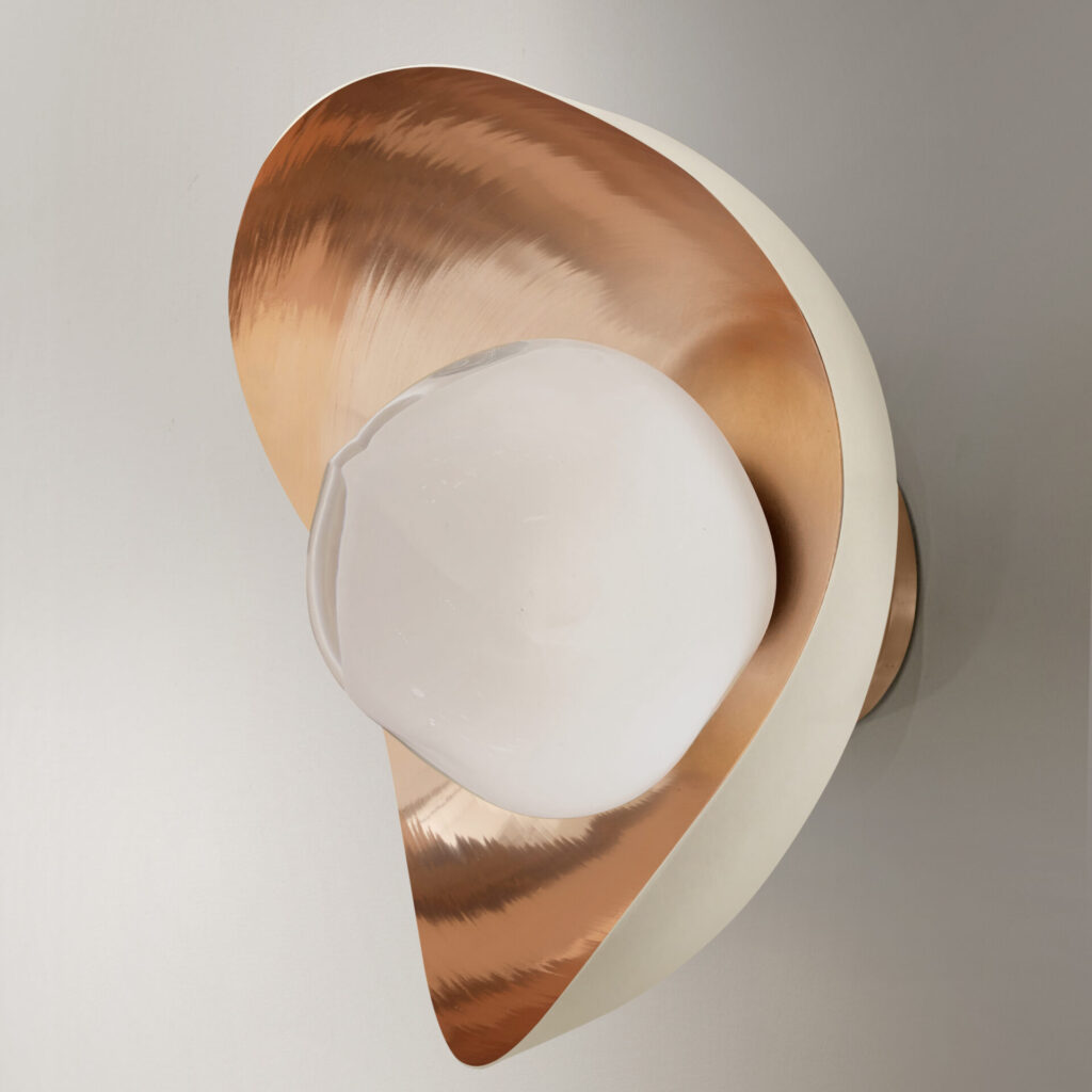Sand-white exterior wall light with a polished copper interior, cradling a handblown glass globe in an asymmetrical shell form.