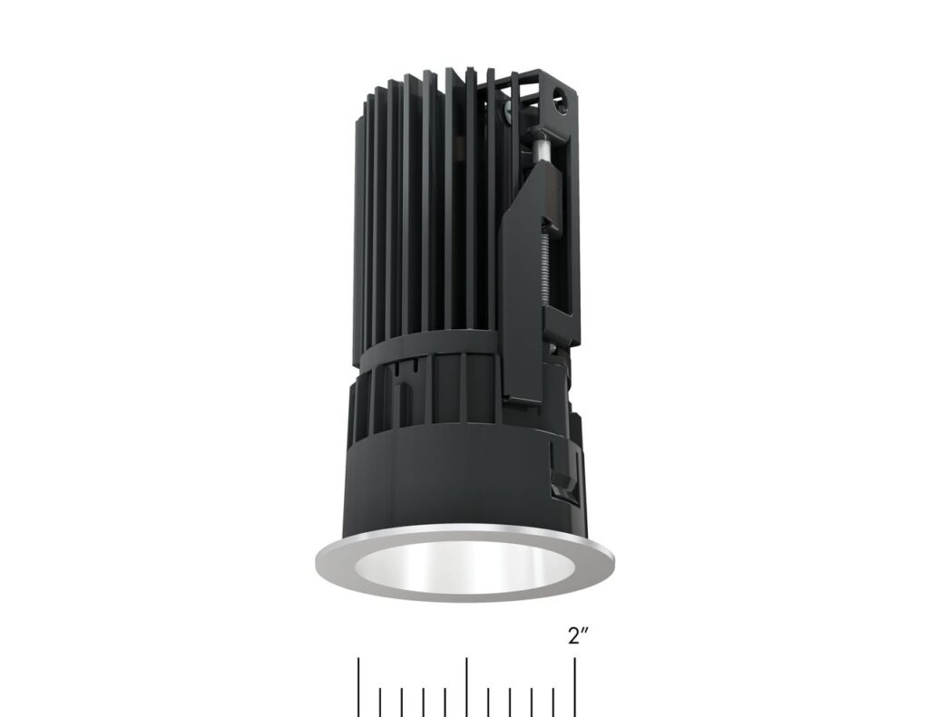 Cutaway view of a 2-inch recessed lighting fixture showing compact heat sink, precision optics, and integrated mounting hardware engineered for high-output performance in a minimal aperture.