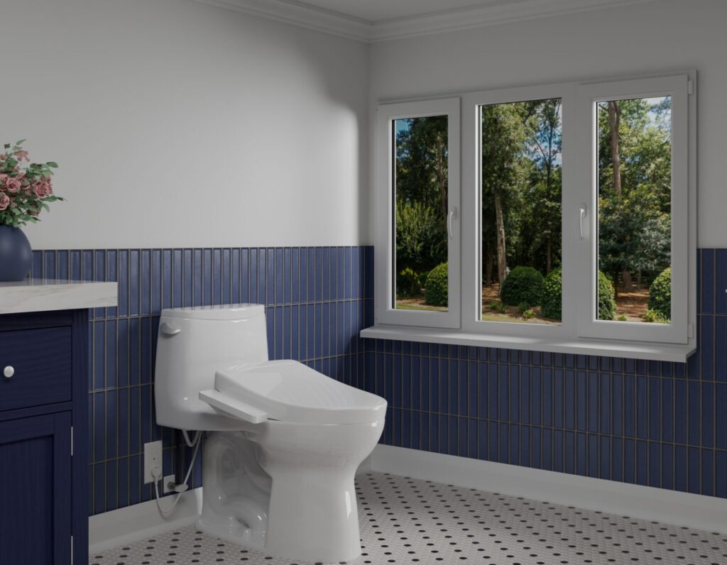 Ultramax one-piece toilet in a blue-tiled bathroom with garden views, featuring a streamlined profile and integrated WASHLET — high-performance commercial bathroom design.