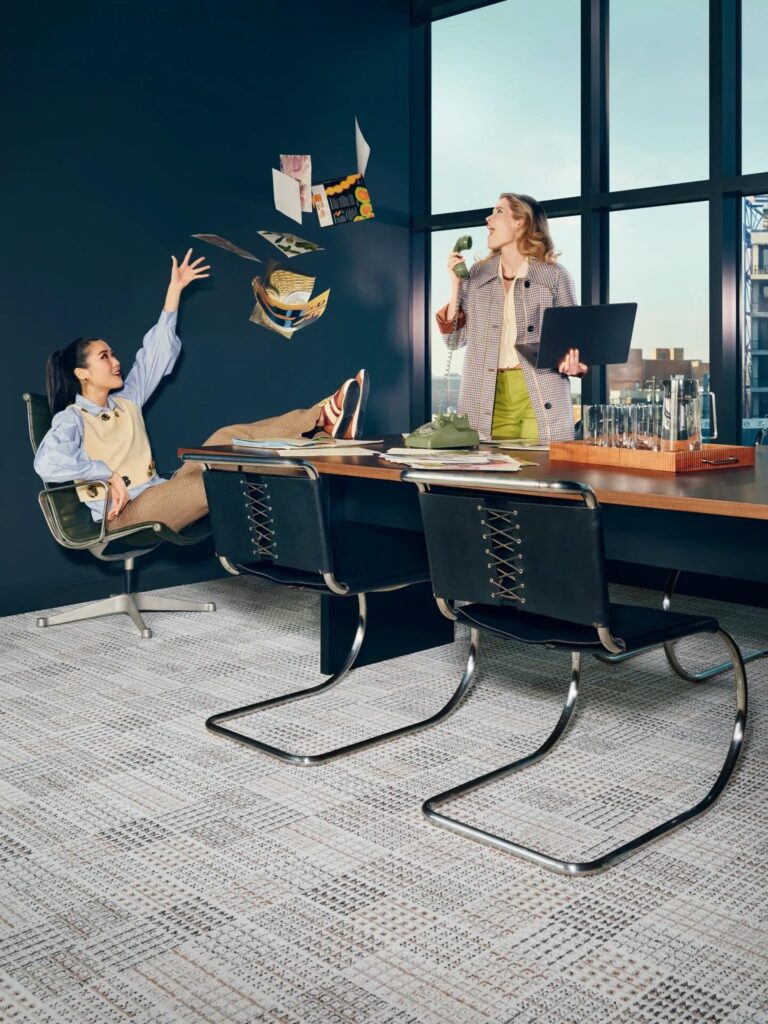 Commercial carpet tile from Shaw Contract's Cult Classics collection installed in a modern conference room with archival-inspired neutral patterning.