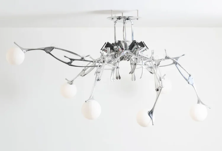 LUMIAC kinetic lighting fixture by Andrea Mancuso Studio features articulated aluminum arms and glowing blown-glass globes suspended from the ceiling.