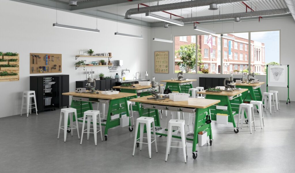 Build Makerspace Tables by HON with pegboard storage panels and butcher-block tops create a mobile STEM classroom workspace.