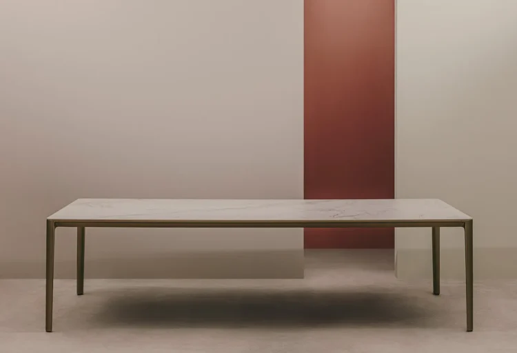 Andreu World's Fusion conference table by Rodolfo Dordoni features a slim stone-look top and die-cast aluminum legs with minimalist detailing.