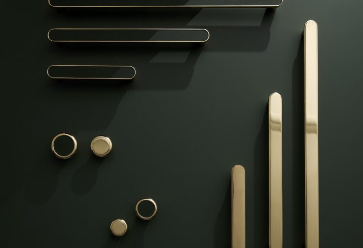Vestige custom cabinet hardware featuring brass cabinet pulls and matching knobs in multiple lengths with minimalist color-matched inserts.