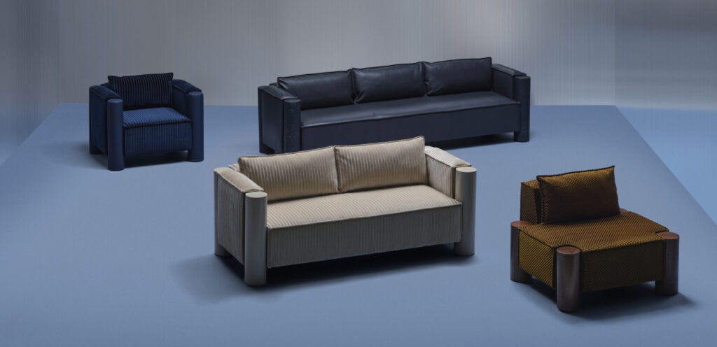 HBF Cosme lounge seating collection by Mark Grattan featuring sofas, lounge chairs, and an ottoman with oversized column legs in velvet, leather, and textured upholstery.