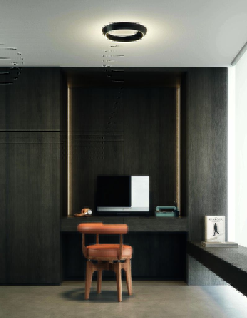 Black Lodes Tidal modern ceiling lighting installed above a compact home office, casting indirect light across dark wood millwork.