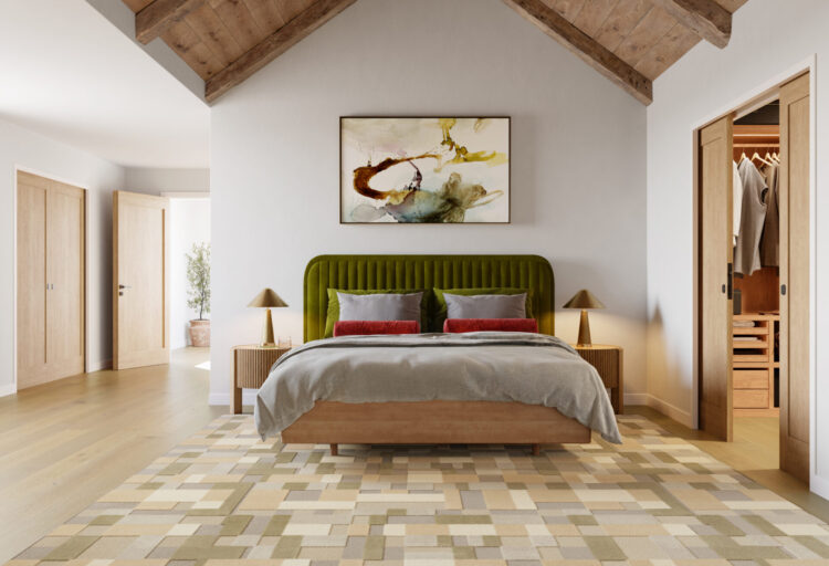 Anderson Tuftex Velluto wool carpet in Azzurro installed in a contemporary bedroom with exposed wood beams and an olive green upholstered bed.